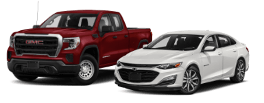 red_2020_gmc_sierra_truck_model_and_white_2020_chevrolet_malibu_sedan_model